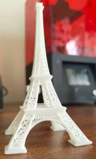 White lattice tower model with four feet