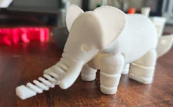 White elephant model with a segmented trunk