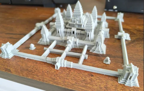 White architectural components arranged on a table before assembly